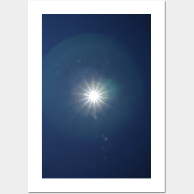 Lumina Solar Eclipse II - white star like sun glare on clear navy blue sky and chromatic aberrations (lens flares) photograph Wall Art by natashakolton